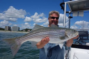 Sammy with a 38"/30-pound bass caught while fishing with Capt. Keith Hall of Maine Coast Guide Service.