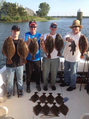 Members of the Cookstown Anglers Club after a great day of flukin' with On A Mission Fishing Adventures.