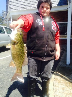 Sean Belair with a 3.33-pound smallmouth caught while fishing the Hook-Up's kids fishing derby on the lower Cape. The fish was safely returned alive to its Cape pond.