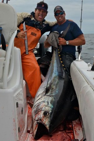 Capt. Bobby Rice (right) of Reel Deal Charters caught this 74", 230-pound bluefin yesterday.