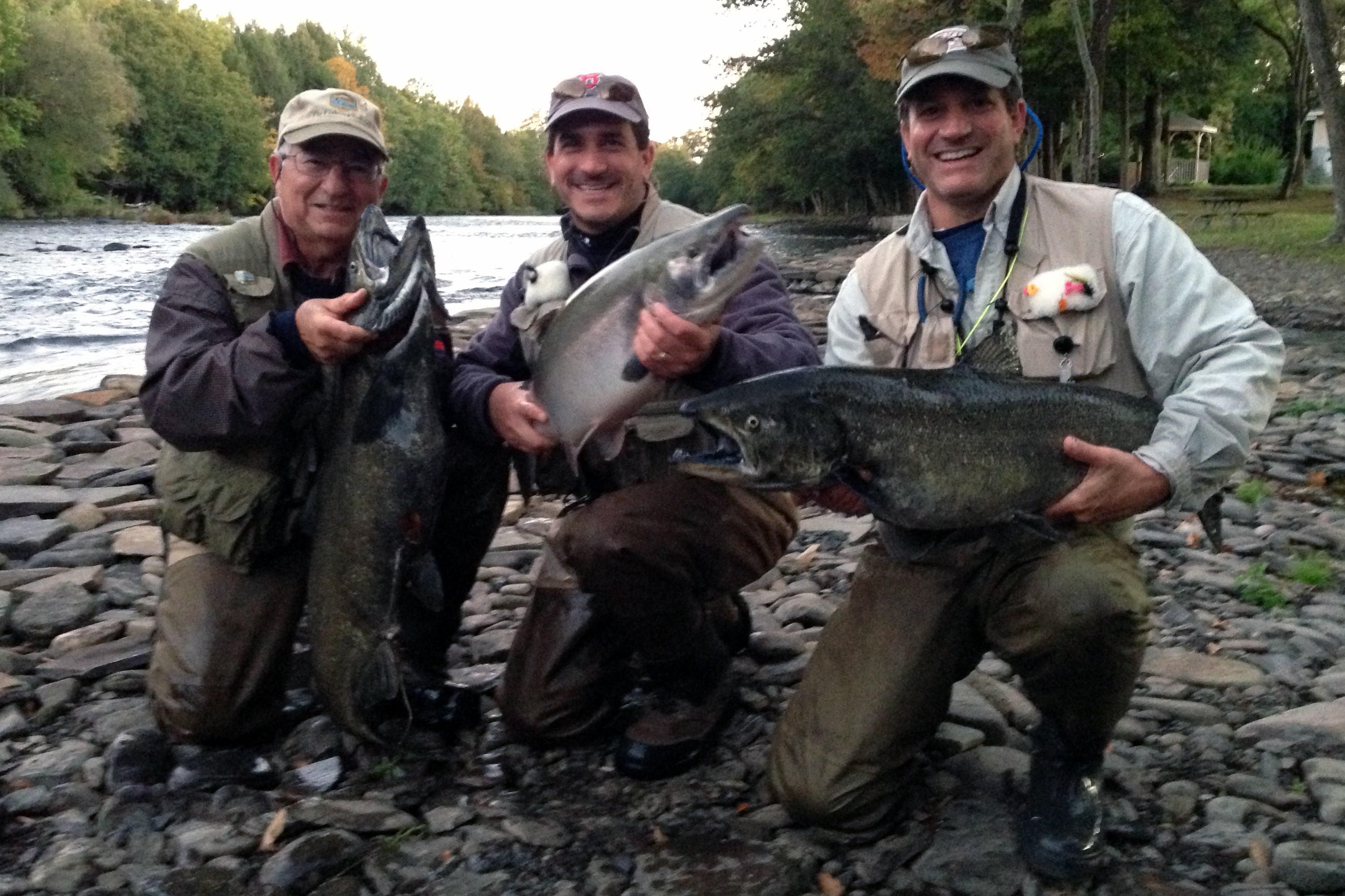 OTW reader Charlie Aftosmis fished the Salmon River in Pulaski last week. Left to right: Charlie with a King, his sons Steve with a Coho and Michel with another King.
