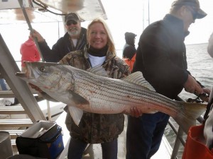 "Mrs. H." with a nice striper caught late last week. Thanks to Meltzer's Sporting Goods Facebook page for the photo.