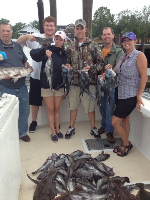 Some happy clients Lucky Hook Charters stand around their limit of Black Sea Bass caught of Clinton CT this past week.