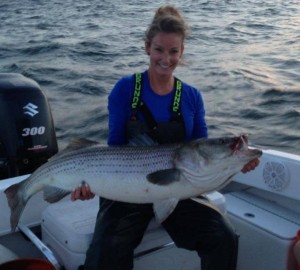 Michaela from Team Amped Up with a monster striper caught out of Clinton, CT.