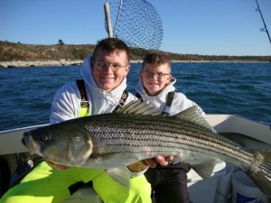 The O'Shaughnessey boys show off a nice Elizabeth Island's striper from last weekend.