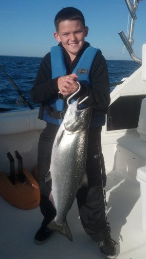 Mark Finney of Jacksonville, FL with his first salmon, a 21 pounder out of Olcott with Cinelli Sportfishing.