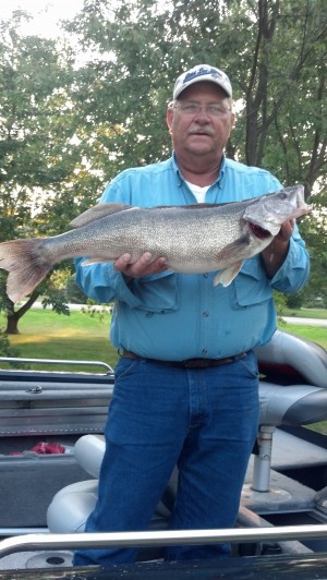 Paul Devlin of Niagara Falls with his 12 pound, 14 ounce walleye reeled in from the Niagara Bar to win the Fish Odyssey Walleye Division!