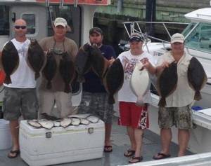 A happy group of Parker Pete's clients after a great day of flounder fishing.