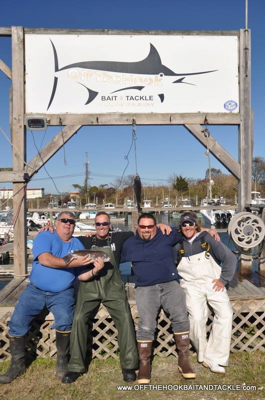 Captain Ricky Wheeler and his crew with one of a limit of blackfish from this past week. 