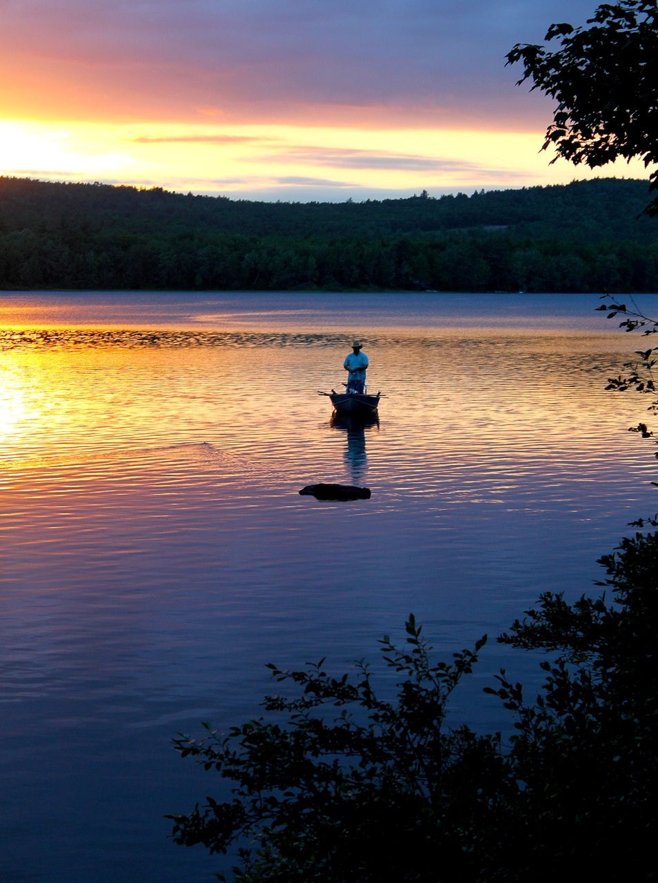 Working a topwater lure for big Maine smallmouths in Bridgton, ME.