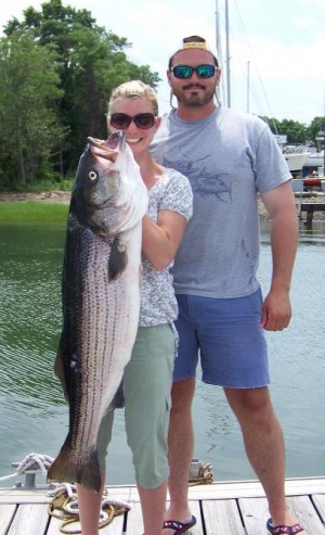 Adam Silvis and his girlfriend Sarah Howe with her biggest Bass, caught this weekend in Boston Harbor on a live Mackerel aboard the Alternative.
