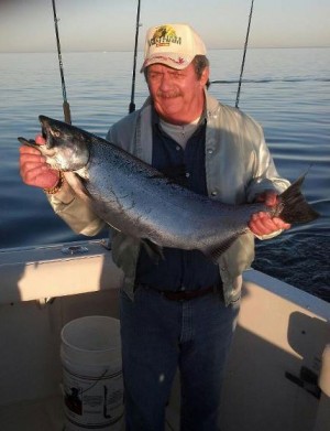 Photo attached of "Smokey" a veteran that has served our country with his personal best fish ever a 22 lb king Salmon taken aboard the "Popeye" this past Sunday.