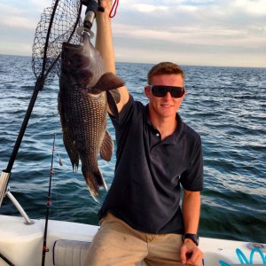 Patrick J. Dougherty, Jr. with his best-ever sea bass caught right outside Narragansett Bay.