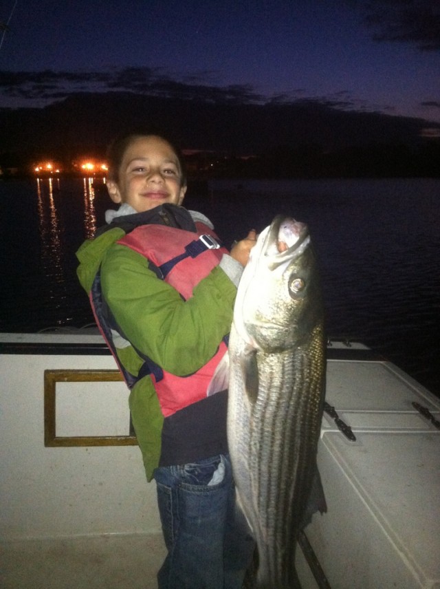 9-year-old Ben Brogioli caught this 38-inch striped bass on a swimming plug in Wareham this week. 