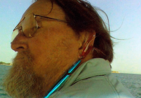 Pops poses for a photo after hooking himself in the ear with a striper plug while out fishing with his close friend “Predator” Phil. After Phil removed the hook, Pops kept right on fishing.