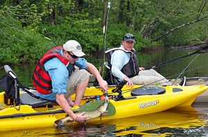 The author and David Hadden, Brand Director of Watercraft, release a healthy Pike caught on a central Maine stream.