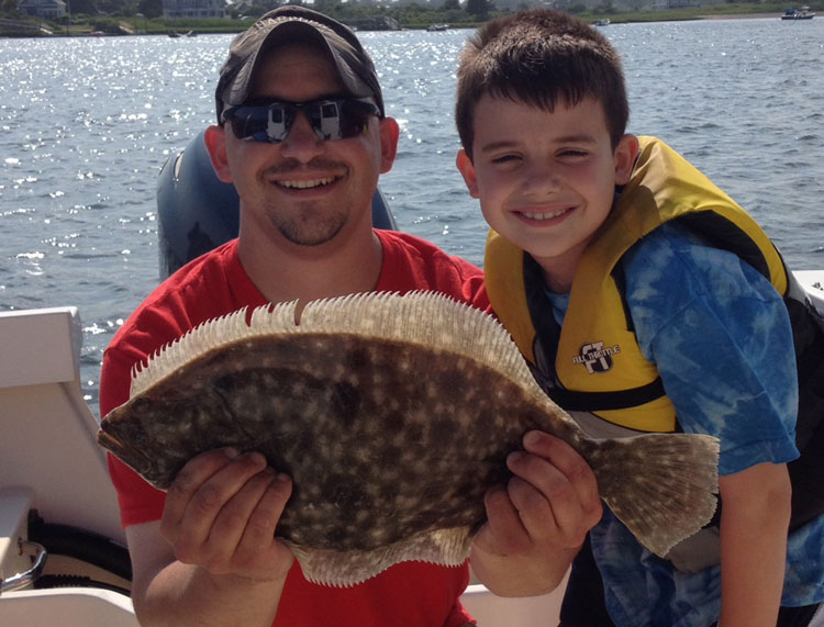Dave Altrich and son Austin with a Buzzards Bay fluke.