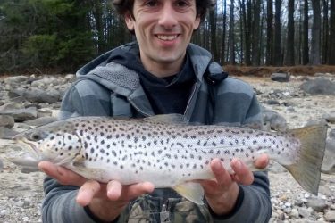 Matthew Musumano with a wild looking brown trout.