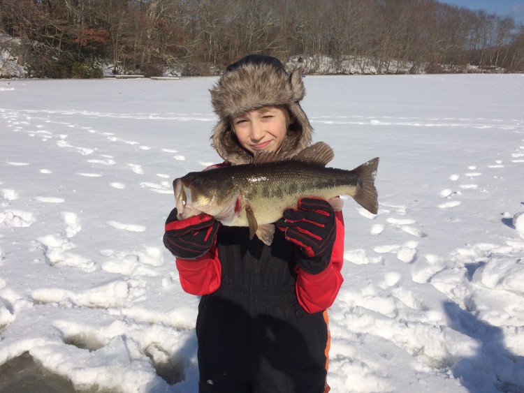 Miles Corayer braved the heavy snow cover to land this Wakefield largemouth bass with his dad Todd.