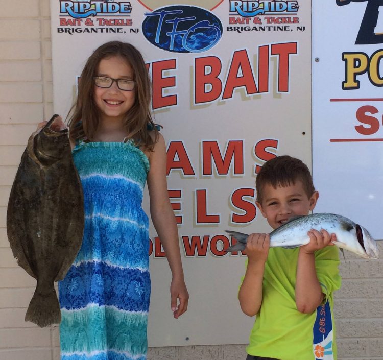 Bella and Jack had a great day of fishing, catching a keeper fluke and a fiesty bluefish. Photo courtesy of Riptide Bait and Tackle. 