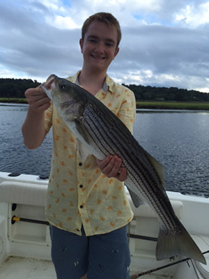 Hugh Gorman with a nice 31" striper taken in the North River.