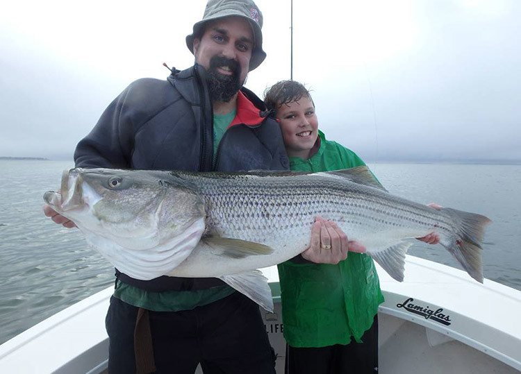 9-year-old Jacob with his first cow bass aboard Reel Cast Charters