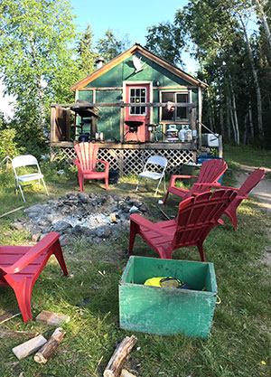 The camp is rustic but comfortable. The main dining cabin has a full kitchen, satellite TV and wireless internet.
