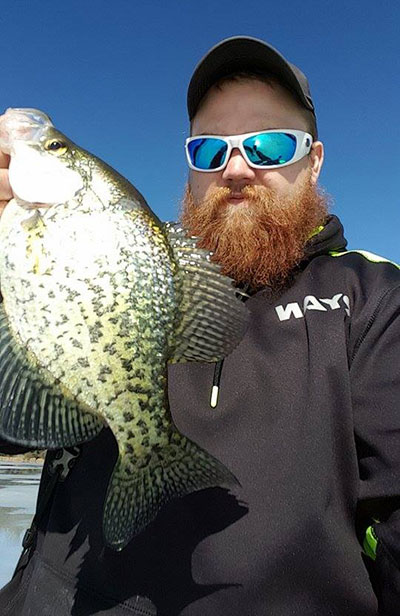 This past weekend was a great time on the ice for Ryan Bailey.  Here he is with a Crappie caught during his day on the ice! (photo provided by angler)