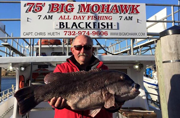 Howard DiCicco with the 22-ppound, 13-ounce monster caught aboard the Big Mohawk.