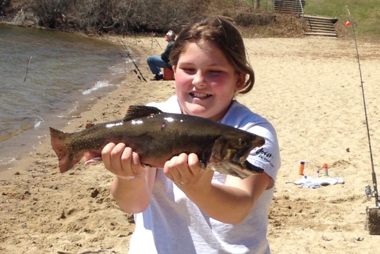 Peters Pond may offer the best shot at a trophy trout on the Cape. Pictured here is Riley Rabesa with her Gold Pin, 3-pound, 13-ounce brook trout taken last spring.