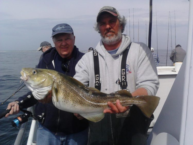Bob Matthews (left) with a 10-pound cod caught aboard the Skylarker out of Belmar.