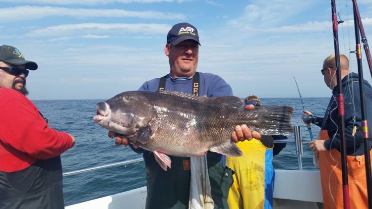 Joe Zagorski with the 21.25-pound blackfish he caught aboard the Fish Monger.