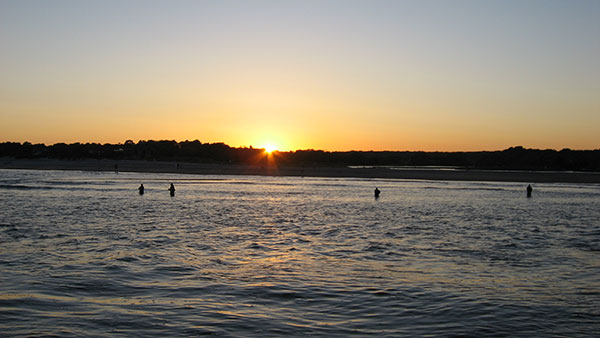 Low light periods at either end of the day are the absolute best times to be out looking for striped bass in the surf.
