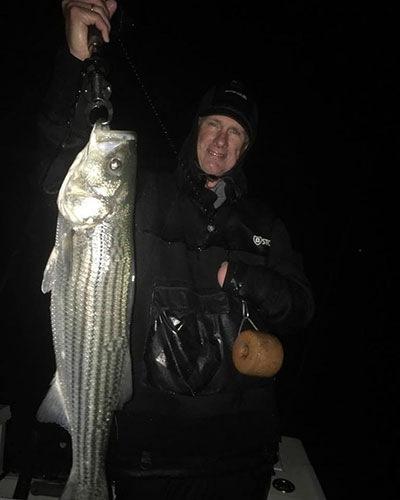 A nice bass taken aboard Reel Cast Charters, despite nasty conditions.