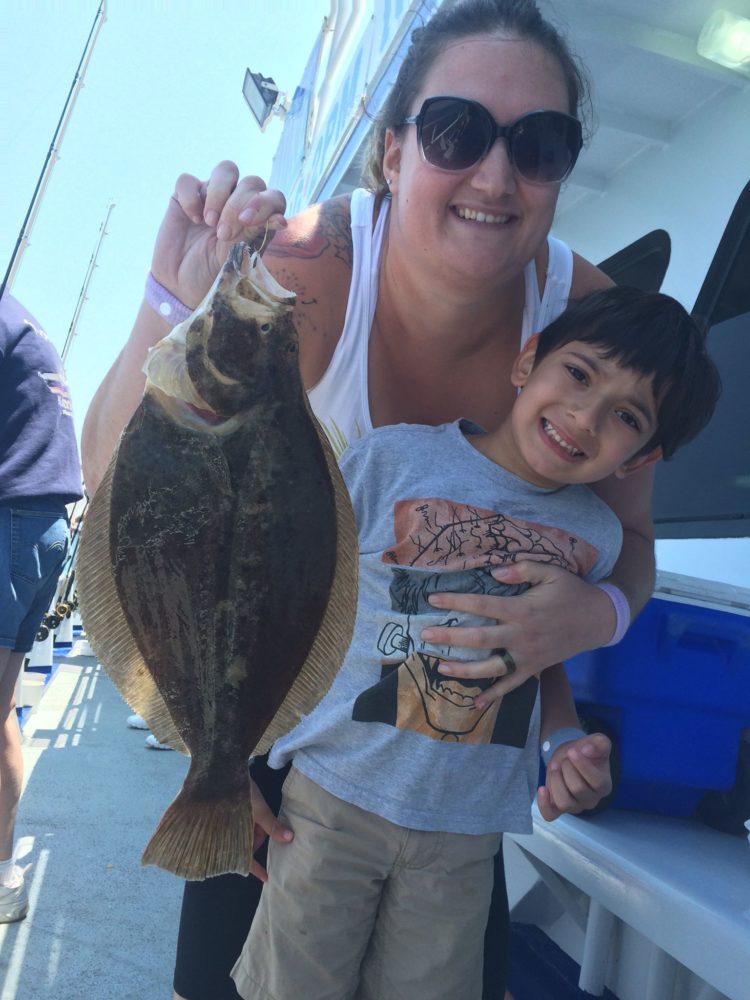 Fluke fishing has been fun for all ages this week. Here's a happy family with a keeper caught aboard the Norma K III