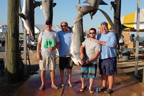 The winning crew of the Spare Parts with their 280-pound Thresher.