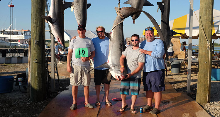 The winning crew of the Spare Parts with their 280-pound Thresher.