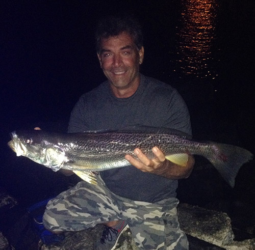 The author showing off a nice weakfish caught late in the evening.