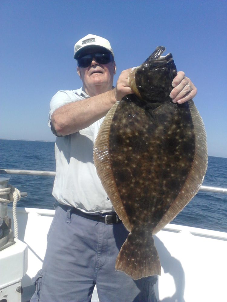Hugh Toal of Jackson got this 11.2-pound doormat aboard the Skylarker on Wednesday.