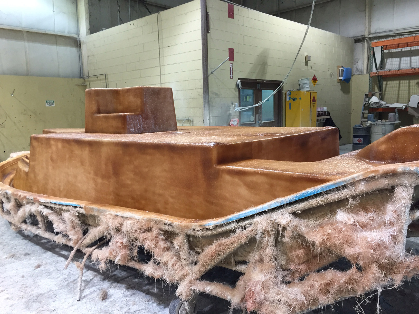 the second step of adhesion where stringers are now permanently glassed to the hull