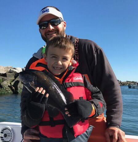Seven-year-old Tide Hawley's first unassisted keeper tog, caught with his father Pete aboard their 25' Dusky Jennifer Lynn out of Clinton,CT