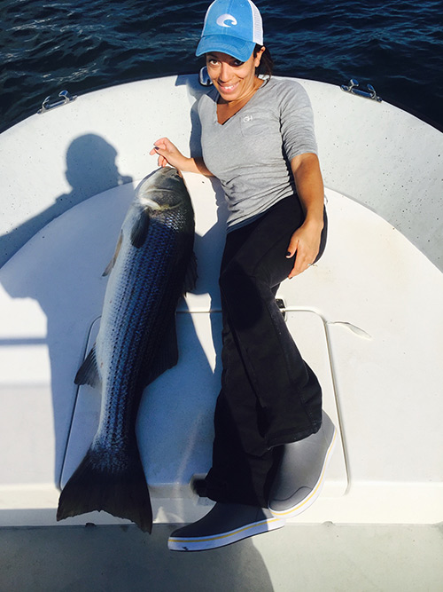 Alicia Kennedy with one of many huge topwater bass she landed on a recent trip.