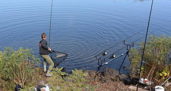Angler Pavel Hastik netting a big carp