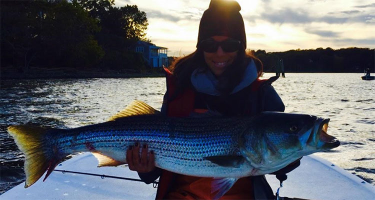 Alicia Kennedy with a nice Connecticut topwater striper.