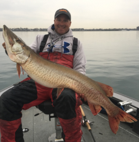 Capt. Chris Cinelli of Grand Island shows off a big musky he caught Wednesday morning.
