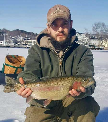 Nate Woodward with a beautiful Winnipesaukee rainbow