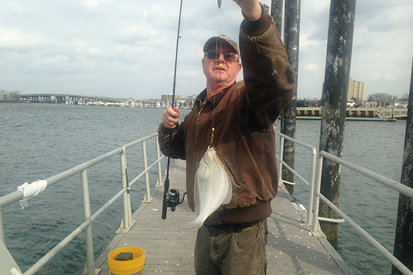Mark Bradley of Point Pleasant hoists a keeper winter flounder