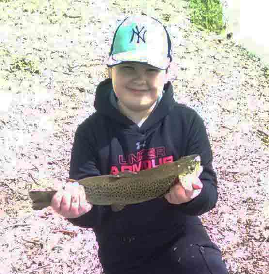 Tom Miles Jr. with a stocker from Hyde Park Lake in Niagara Falls yesterday