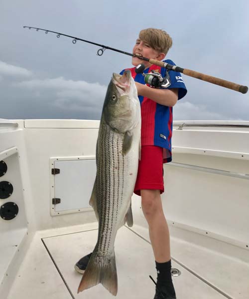 9 year old Aedan casting a topwater plug, caught, revived and released his first big solo striped bass by himself!