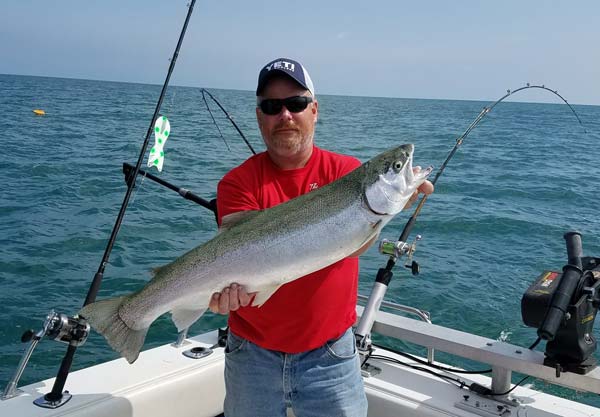 Capt. Jim Gordon holds up a trophy steelhead.